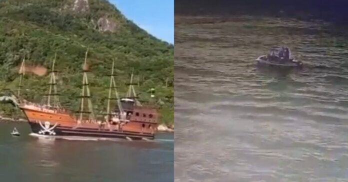 Enquanto namorava em jet ski, casal sofre atropelamento por barco pirata 6 Barco temático de pirata navegando próximo a jet ski com casal em mar calmo rodeado por montanhas verdes