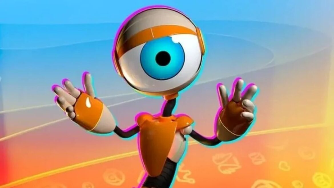 Boneco Roobbc, mascote do Big Brother Brasil, com corpo laranja e um grande olho azul central, acenando com as mãos em frente a um fundo colorido em tons de azul e amarelo.