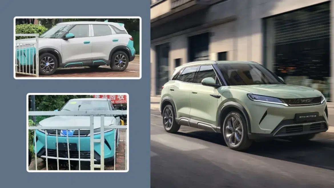 BYD Atto 2 verde claro em movimento na rua, com logo "BYD ATTO 2" visível na traseira e faróis LED acesos
